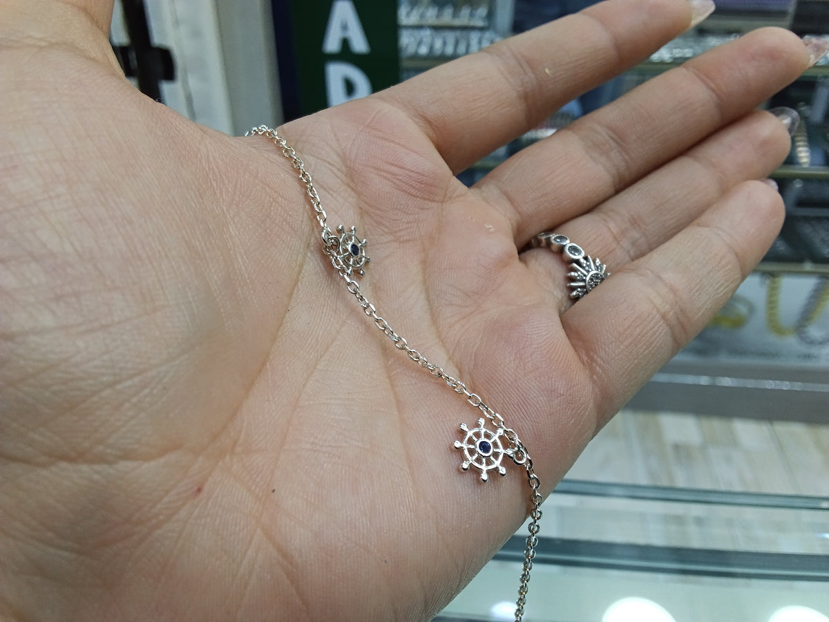 Pulsera timón con zircon azul en plata